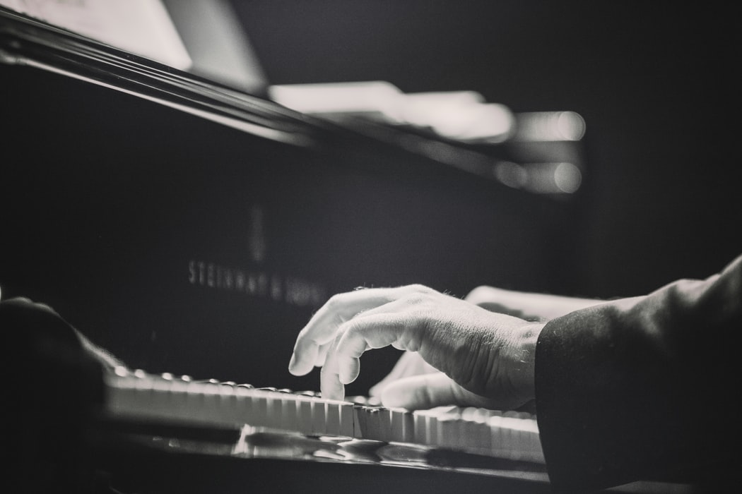 Image of hands playing piano